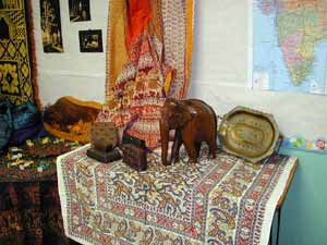 brass work, carved teak, and batik display